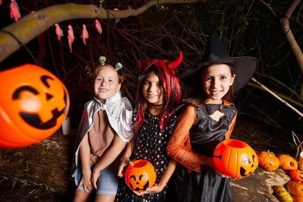 Friends in costumes at party — Stock Photo, Image