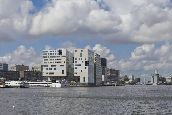 stock image Amsterdam port area with modern buildings at the dock of the canal Het IJ 