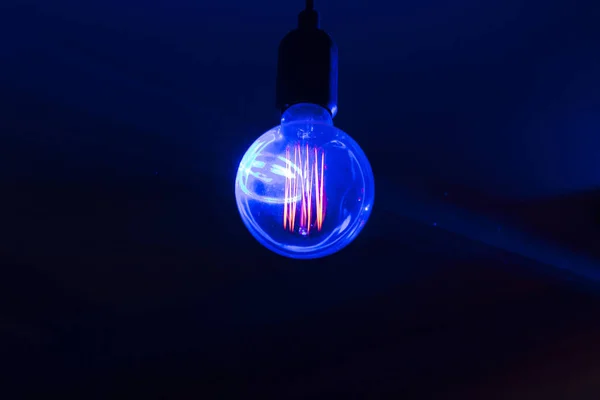 Glowing Orange Decoration Lightbulb Dark Blue Magenta Background — Stock Photo, Image