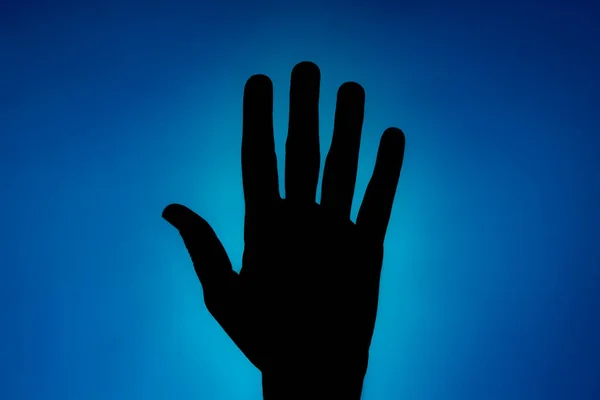 Clean Silhouette Hand Blue Background Spotlight Bright Area Right — Stock Photo, Image