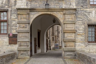 Wewelsburg, Germany - September 11, 2019: Architectural detail of the main access portal to the courtyard of the Wewelsburg castle with brick construction clipart
