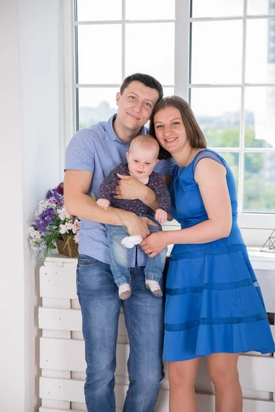 Happy Young Caucasian Family Posing in Studio — Stock Photo, Image