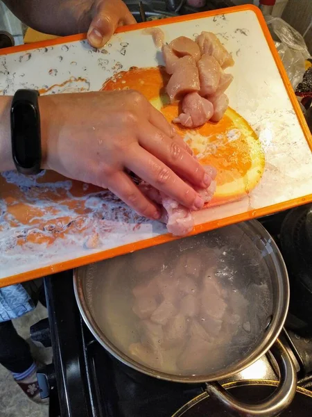 Partial View Woman Throw Sliced Uncooked Chicken Meat Saucepan Water — Stock Photo, Image