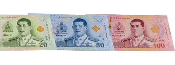 Сукупні банкноти Таїланду Бахта виділені на білому тлі.. — стокове фото