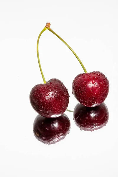 Double Cherry with reflection on a light background — Stock Photo, Image
