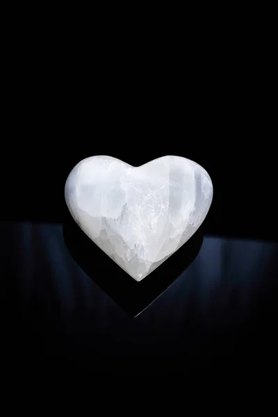 Stone heart on black background — Stock Photo, Image