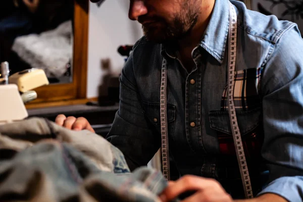 European Man Sews Clothes His Sewing Workshop Home — Stock Photo, Image