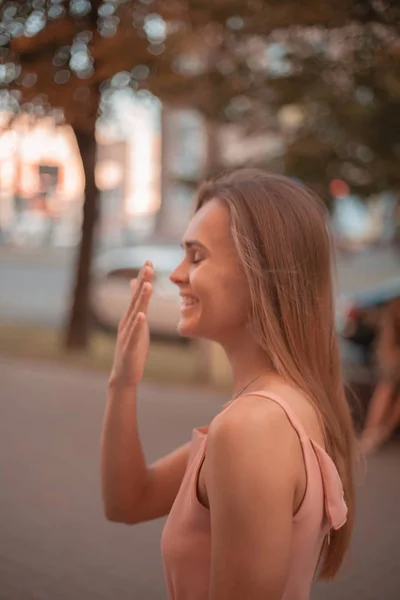 Portrait of a happy girl on the street. Autumn colors.