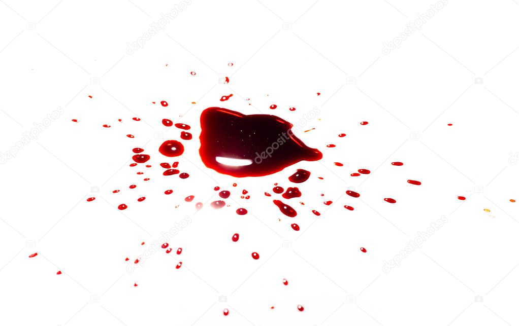 Blood on a white background. Drops and splashes of blood on a white background.