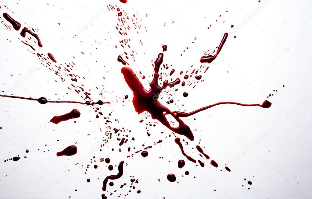 Blood on a white background. Drops and splashes of blood on a white background.