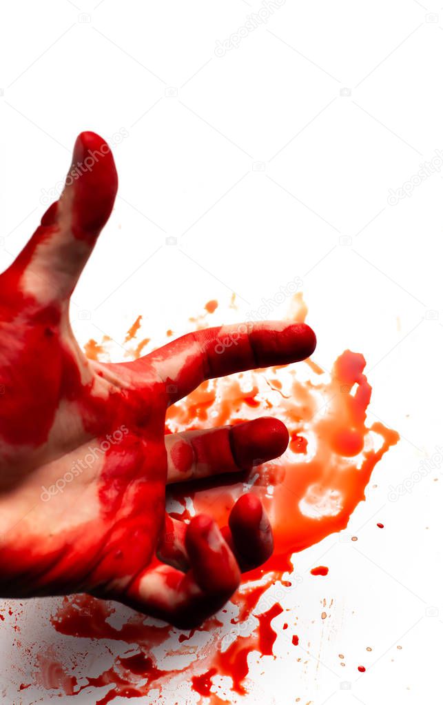 Male bloodied hand on a white background with splashes and drops of blood.