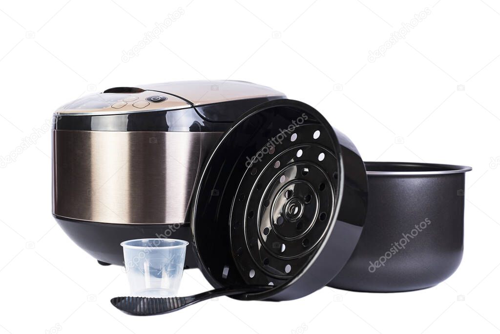 Automatic multicooker and accessories set isolated on a white background. Modern cooking appliance and convenient interchangeable accessories.