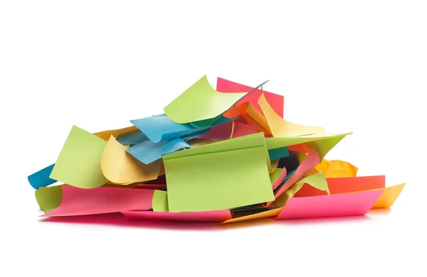 Used colorful stickers notes heap isolated on white. Side view. Stationery colored sticky notes.