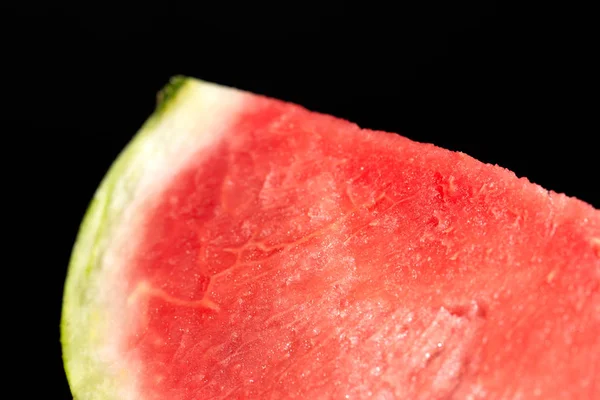 slice of watermelon on black background