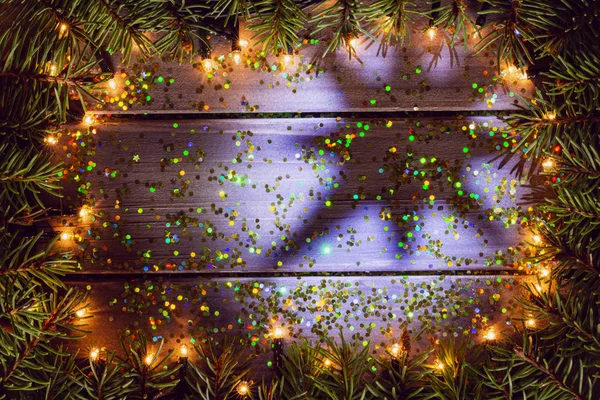 Ahşap arka plan üzerinde gölge yıldız ile Noel çerçevesi, metin için kopya alanı ile Noel arka plan