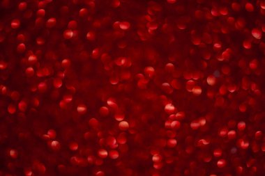 Bokeh efektli kırmızı noel kartı süslemesi. Yeni yıl arkaplanı. Odaklanmamış sim efektli, lüks ve zarif dekorasyonlu.