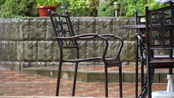 Table and chairs in summer cafe under heavy rain — Stock Footage Table Chairs Summer Cafe Heavy Rain Stock Video