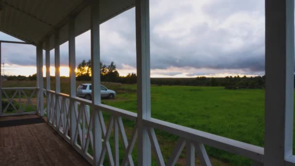 Beautiful sunset from the veranda of the summer cottage. Timelapse — Stock Footage Beautiful Sunset Veranda Summer Cottage Timelapse Royalty Free Stock Footage