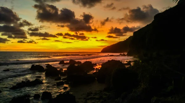 Tropical beach at sunset - nature background. Menganti Beach, Kebumen,Central Java, Indonesia — Stock Photo, Image