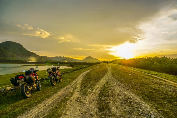 Purwakarta, West Java, Indonesia (03/30/2018) : The rider is touring with his motorcycle through the Jatiluhur Dam side which is commonly called Parang Gombong