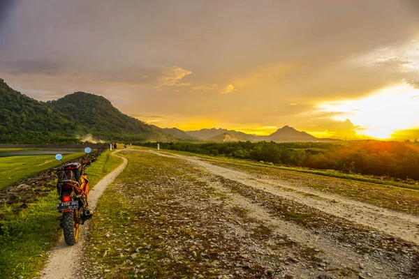 Purwakarta, West Java, Indonesia (03/30/2018) : Purwakarta, West Java, Indonesia (03/30/2018) : The rider is touring with his motorcycle through the Jatiluhur Dam side which is commonly called Parang