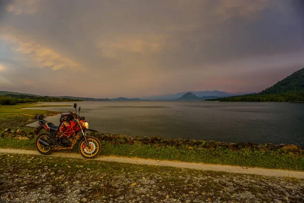 Purwakarta, West Java, Indonesia (03/30/2018) : Purwakarta, West Java, Indonesia (03/30/2018) : The rider is touring with his motorcycle through the Jatiluhur Dam side which is commonly called Parang