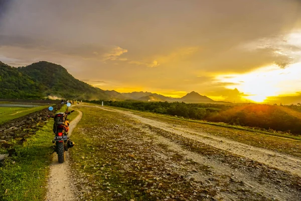 Purwakarta, West Java, Indonesia (03/30/2018) : Purwakarta, West Java, Indonesia (03/30/2018) : The rider is touring with his motorcycle through the Jatiluhur Dam side which is commonly called Parang