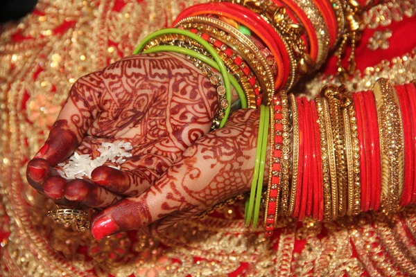 Indian couple Ring ceremony. Indian ritual seen before wedding hand shake together bride with groom. Indian loving couple is getting married. lovely bride hands with mehndi.