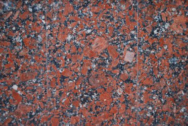 Kırmızı granit levha dokusu yakın plan.