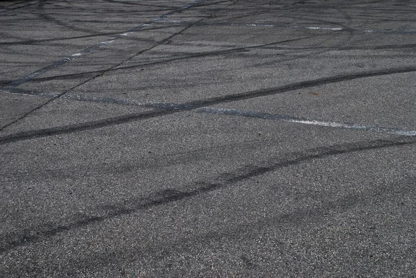 Black tire marks of a car on asphalt
