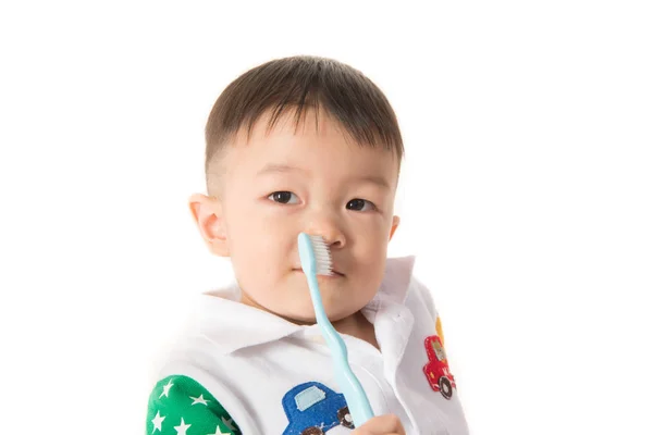 Азиатский Мальчик Берет Зубную Щетку Чистки Зубов — стоковое фото