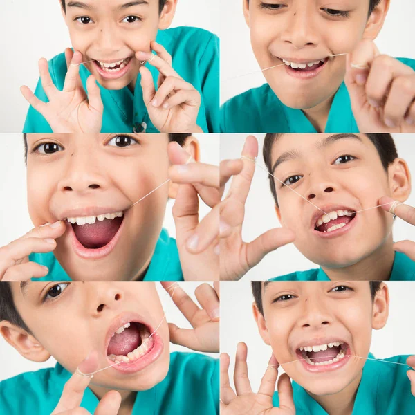 Küçük Çocuk Temiz Diş Için Diş Ipi Kullanarak — Stok fotoğraf
