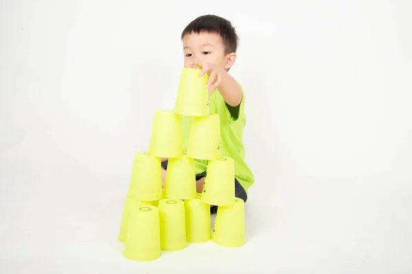 Asian Boy Playing Speed Plastic Glass Stacking — Stock Photo, Image