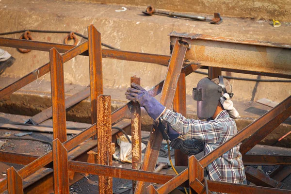 Industrial welder welding fabricated construction in factory — Stock Photo, Image