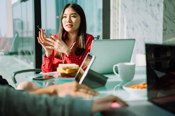 Beautiful young asian thai businesswoman in red shirt making presentation  with co-worker colleague in meeting room. Beautiful boss business girl. |  Stock Images Page | Everypixel