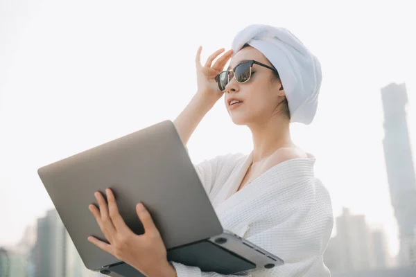Young Woman White Bathrobe Wearing Sunglasses Working Laptop Working Home — Stock Photo, Image