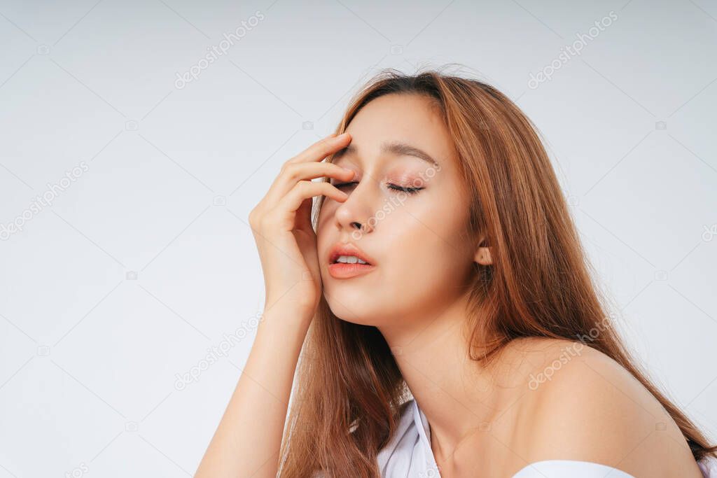 Beautiful woman in white shirt with natural make up isolated over white background. Skincare facial treatment concept.