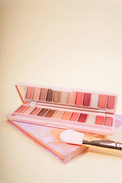 Beauty routine. Makeup palettes with blushes and powder. Minimalist beauty flat lay. Beauty palettes with mirrors. Make up products in minimalist palettes. Pastel blush and powder. Beige, pink colors.