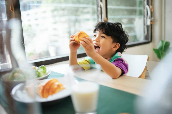 Little Boy Hold Sausage Croissant His Hands Smile Happiness His — Stock Photo, Image