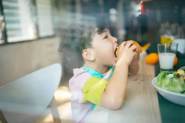 Little Boy Eat Sausage Croissant His Breakfast Snap Glass Window — Stock Photo, Image