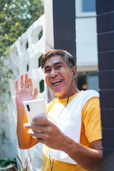 Old Man Yellow Shirt Standing Front His House Wave His — Stock Photo, Image