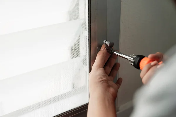 Hand Handyman Fixing Window Handle Orange Screwdriver — Stock Photo, Image