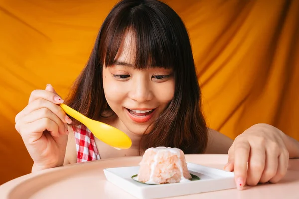 Young asian woman eating sweet sticky rice with yellow spoon. | Stock  Images Page | Everypixel