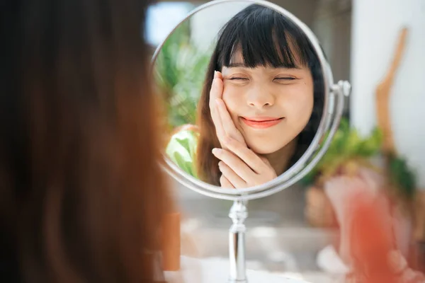 Close Young Asian Woman Applying Face Cream Looking Mirror — Stock Photo, Image