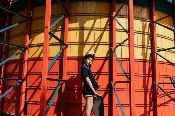 Woman Dark Blue Polo Shirt Standing Front Yellow Red Wall — Stock Photo, Image