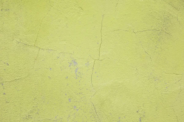 Wall fragment with scratches and cracks. Concrete weathered yellow wall — Stock Photo, Image