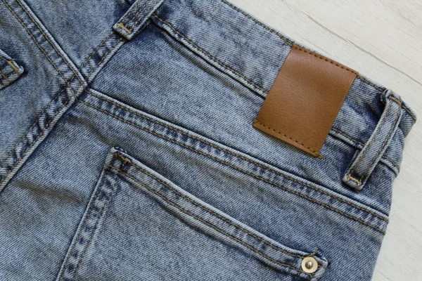 Blauw denim jeans broek element achtergrond. — Stockfoto