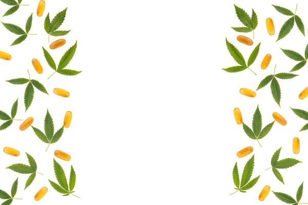Frame with cannabis leaves and oil capsules isolated on white background. Cannabis pattern with copy space in the middle