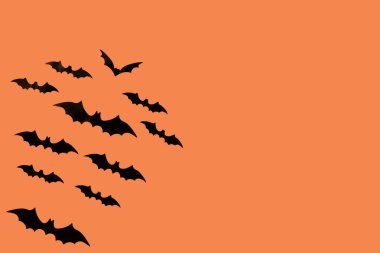 Yarasalar ile Halloween kağıt süslemeleri. Turuncu arka plan üzerinde Cadılar Bayramı yaratıcı kompozisyon. Düz döşeme, üst görünüm ve kopyalama alanı