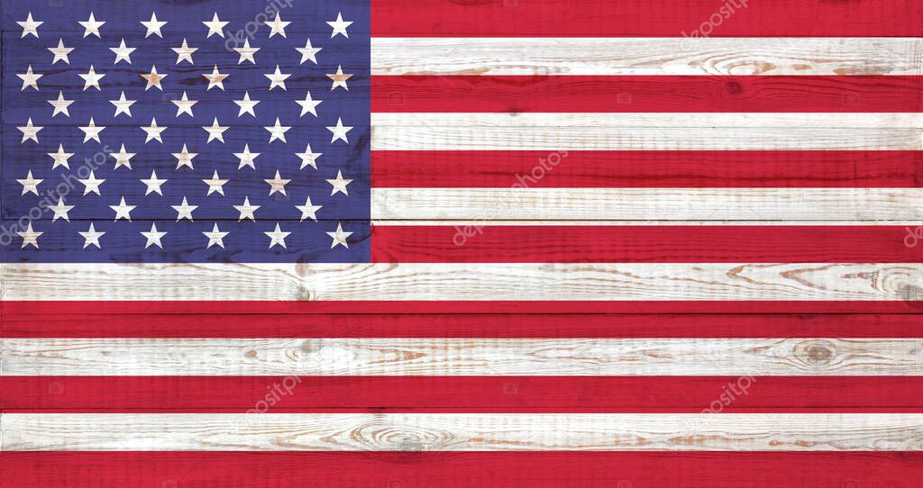 USA flag painted on an old wooden background. textured backdrop and concept of flag day. thirteen red and white stripes and fifty stars